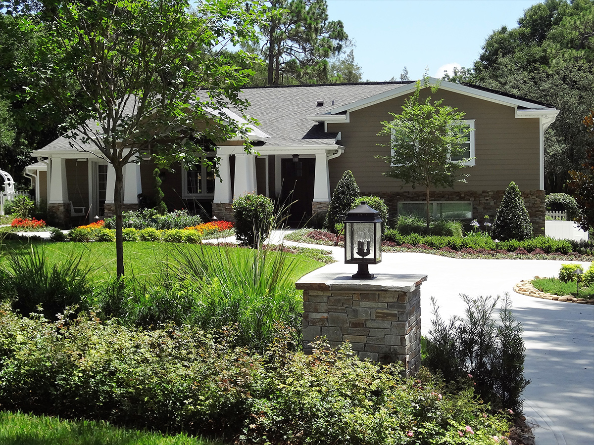 Estate landscape enhancement featuring mature landscaping, specimen trees, front entry improvements, and cohesive residential landscape design in Orlando, Florida Estate landscape enhancement featuring mature landscaping, specimen trees, front entry improvements, and cohesive residential landscape design in Orlando, Florida
