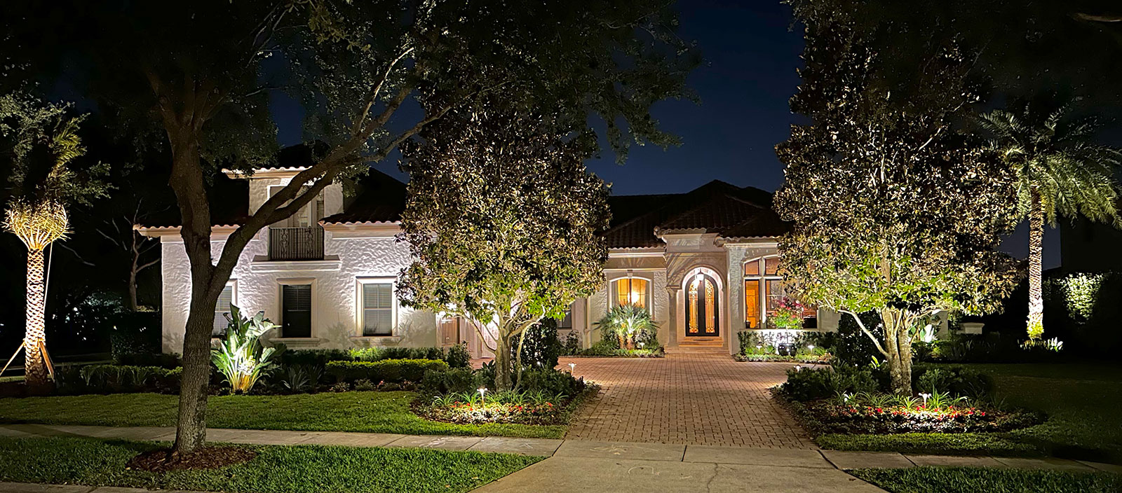 Estate landscape enhancement featuring integrated pool design, outdoor living spaces, mature landscaping, hardscape elements, and cohesive residential property design in Orlando Florida Estate landscape enhancement featuring integrated pool design, outdoor living spaces, mature landscaping, hardscape elements, and cohesive residential property design in Orlando Florida