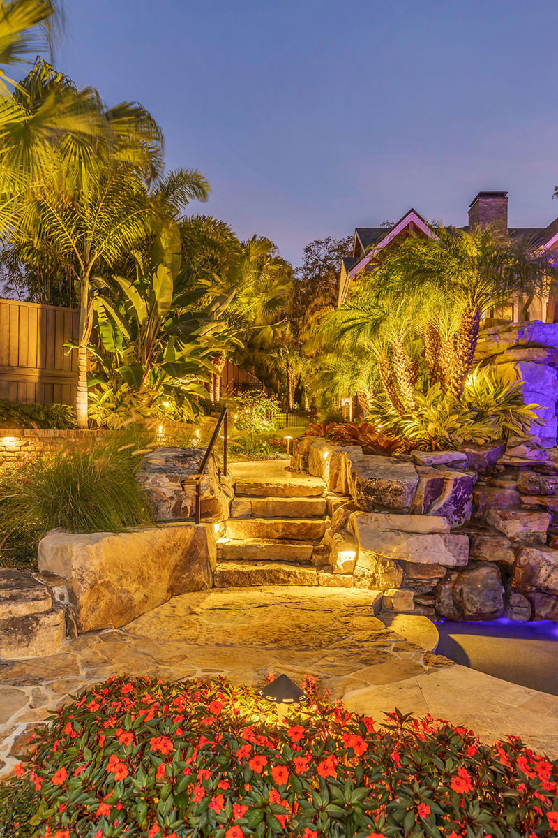 Estate landscape enhancement showcasing outdoor ambience, landscape lighting, mature landscaping, and cohesive property design Estate landscape enhancement showcasing outdoor ambience, landscape lighting, mature landscaping, and cohesive property design